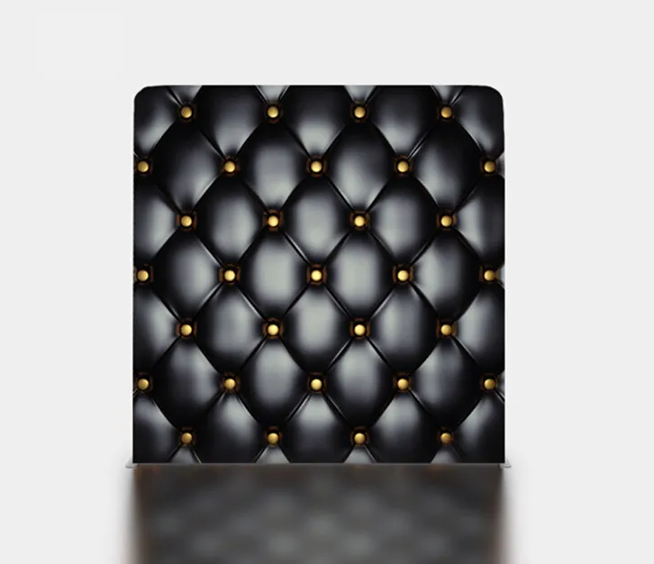 Black quilted photo booth backdrop with gold studs