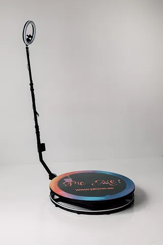 A 360 photo booth platform with its camera arm ready for guests