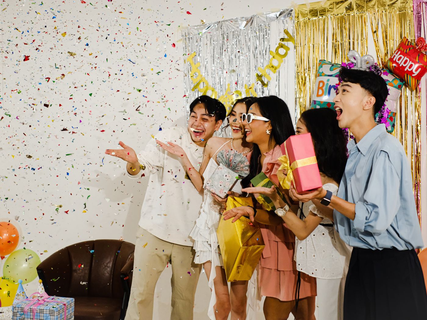 Guests laughing with confetti at a private birthday party on the Costa del Sol