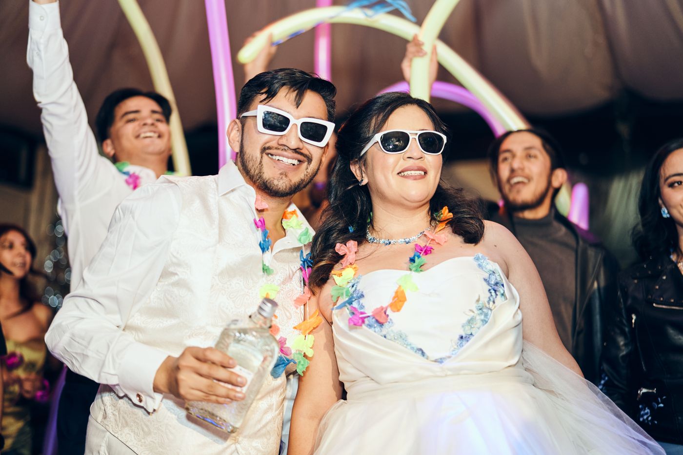 Guests enjoying a festive wedding party with colourful decorations
