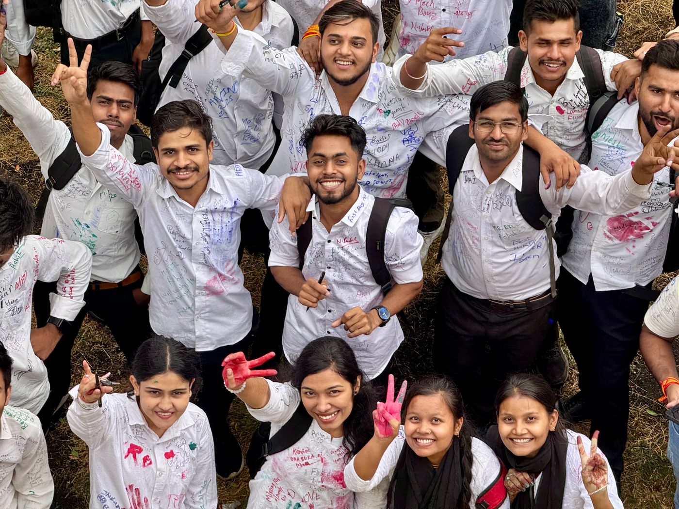 Group of students celebrating the end of the school year together outdoors