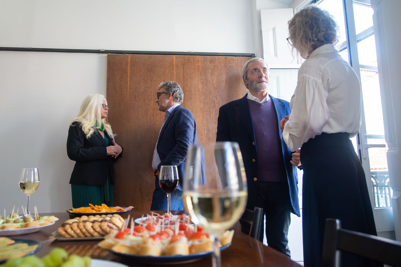 Drinks and canapes at a product launch event with a photo booth nearby