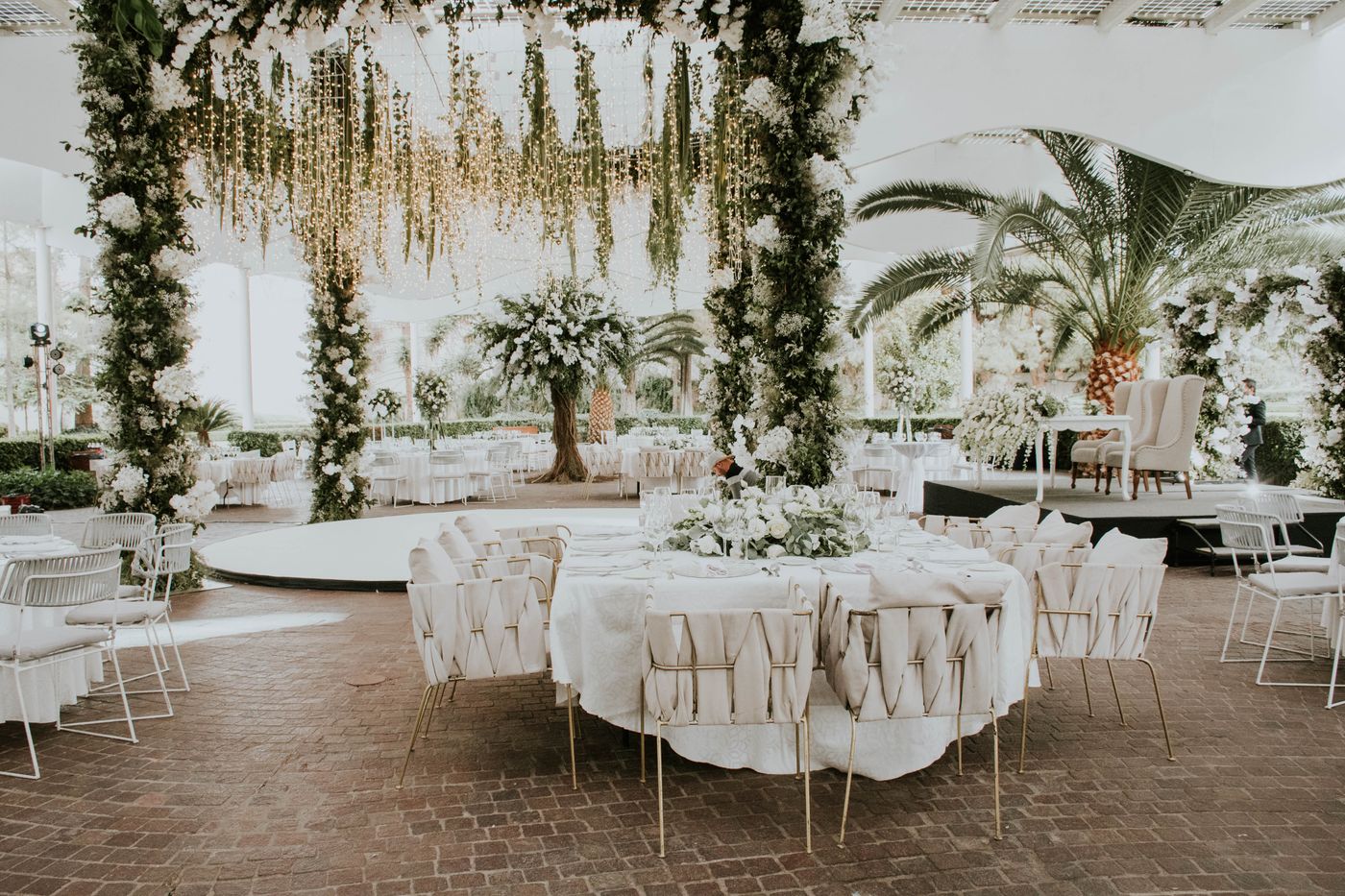 Outdoor wedding setup with floral decorations and ambient lighting reflecting 2026 trends